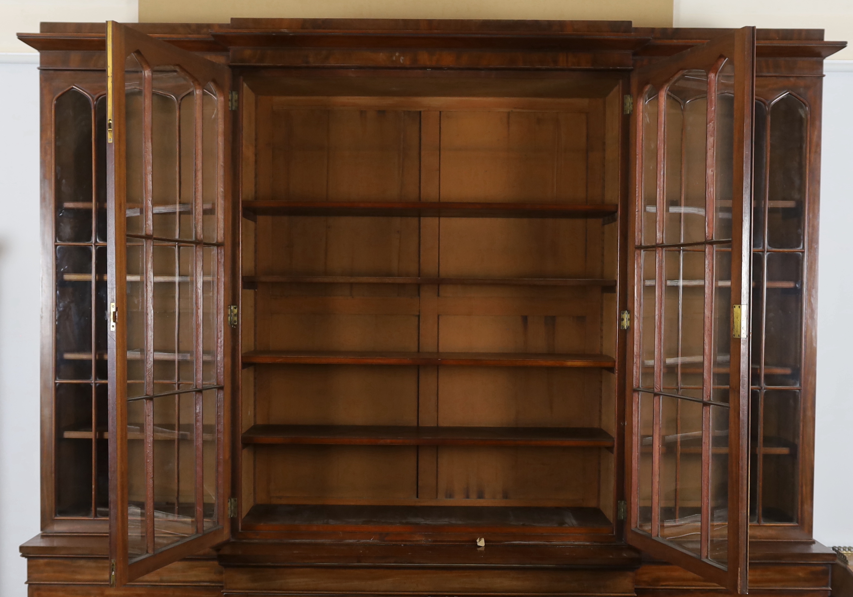 An early Victorian mahogany breakfront library bookcase